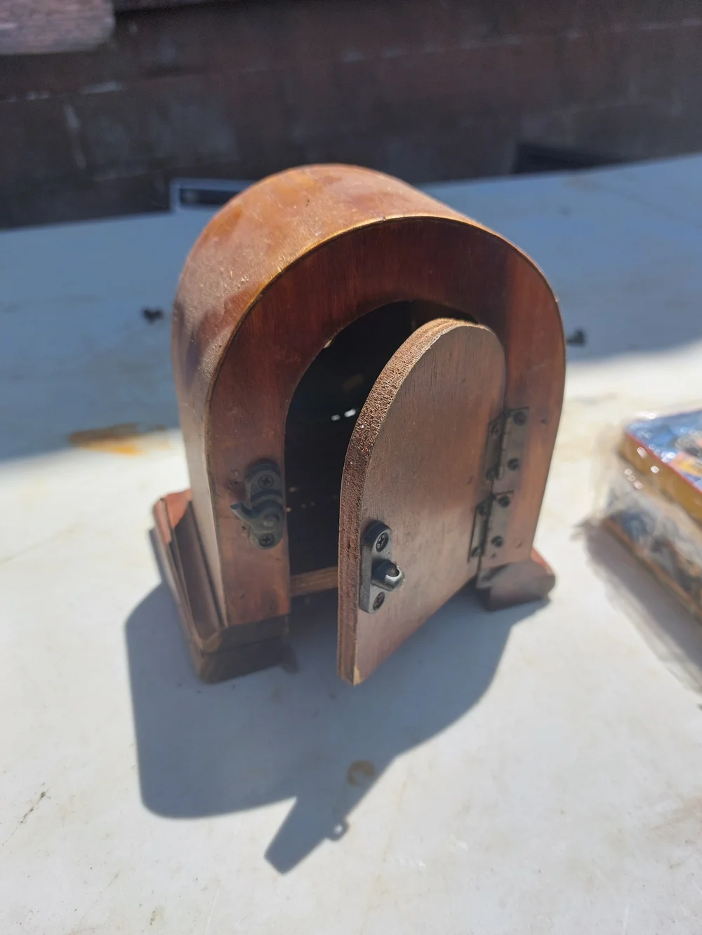 Brown Wood-Style Arch Wall Clock with Yellow Dial
